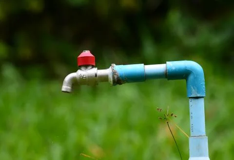 Faucet with in the park Stock Photos