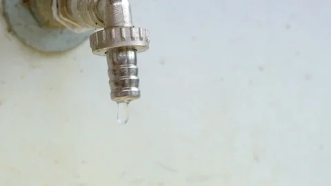 Faucet quickly dripping water, concept saving resources, slow motion close-up Stockbeeldmateriaal 108914417