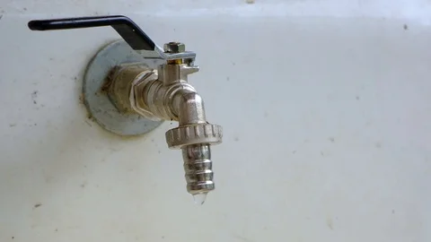 Faucet, quickly dripping water, leaking, concept of  saving resources, close-up Vídeos de archivo 108914398