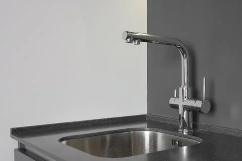 Faucet with sink in the kitchen Foto stock
