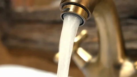 The faucet was opened in the bathroom.	 Stock Footage 114261559