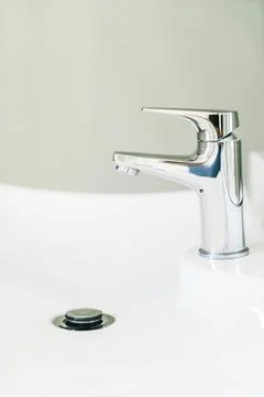 Faucet water in bathroom Stock Photos