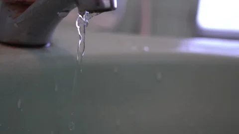 Faucet with water, close up. Stock-Footage 100056639