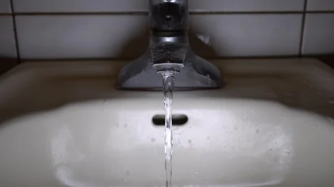 Faucet with water, close up. Video stock 100910565