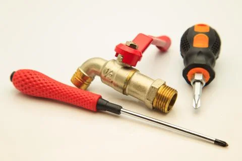 Faucets and screwdriver Stock Photos