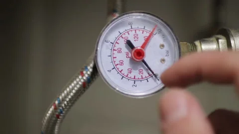 Faulty pressure sensor in the boiler room on the background of pipes. Stock Footage 266091085