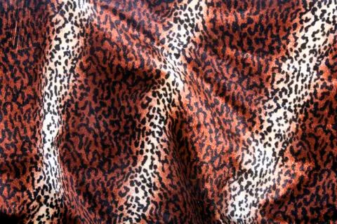 Faux Leopard Print Pattern on Furry Fabric Stock Photos