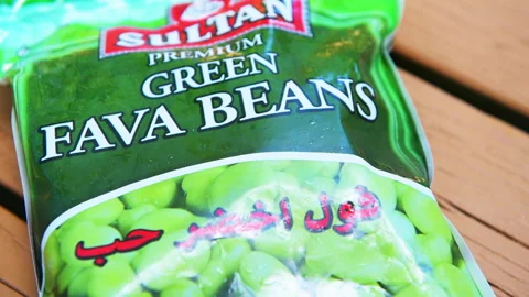 Fava bean broad beans in plastic bag from Egypt brand frozen food macro closeup Stock Footage 321984127