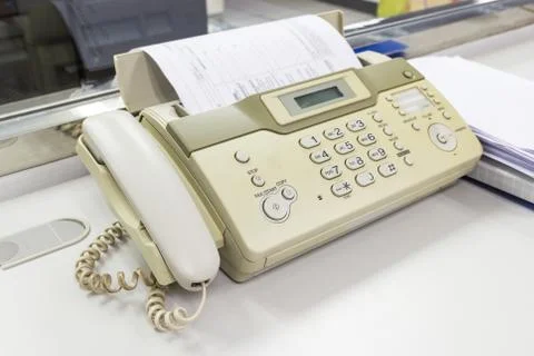 The fax machine for Sending documents in the office 库存照片