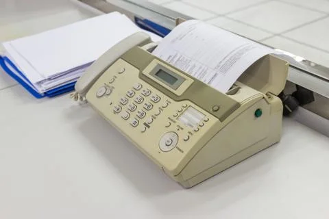 The fax machine for Sending documents in the office Photos