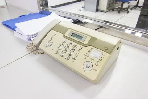 The fax machine for Sending documents in the office Photos