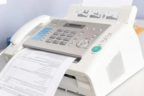 The fax machine for Sending documents in the office 스톡 사진