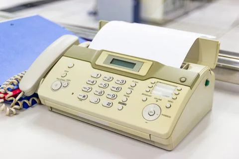 The fax machine for Sending documents in the office Photos