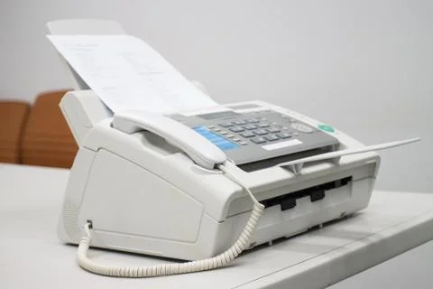 The fax machine for Sending documents in the office 스톡 사진