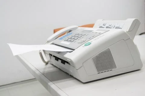 The fax machine for Sending documents in the office Stock Photos