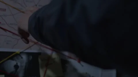 FBI agent following Evidence String on Evidence Board 스톡 동영상 312455229