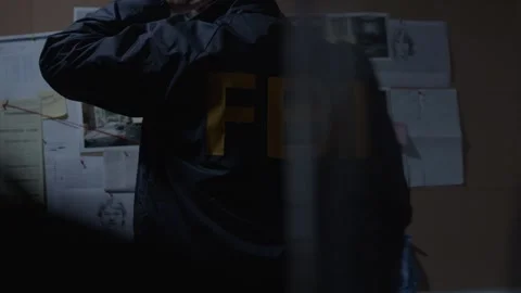 FBI agent frustrated at Evidence Board Stock Footage 312455295