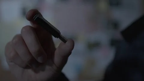 FBI agent looking at USB drive 스톡 동영상 312455491