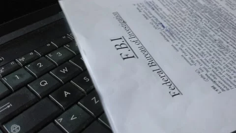 Fbi document on a black laptop. top secret fbi document. 스톡 동영상 218504822
