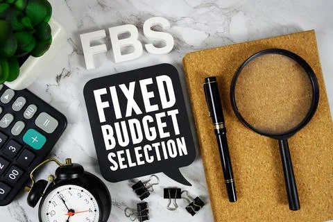 FBS Fixed Budget Selection text with Calculator, alarm clock and magnifying.. Stock Photos