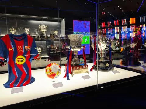 FC Barcelona trophy display and historic jersey in the club museum in Barce.. Stock Photos