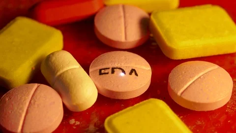 FDA caption print over medicine pill with laser Stock Footage 118300900