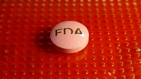 FDA caption print over medicine pill Stock Footage 118308516