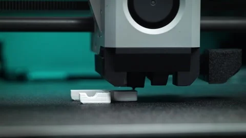 FDM 3D Printer Extruder Melts and Deposits Filament onto the Platform Stock Footage 286244193