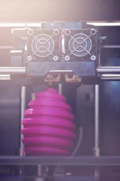 FDM 3D-printer manufacturing wound pink easter egg sculpture - front view on  Stock Photos