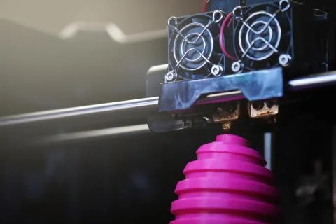 FDM 3D-printer manufacturing wound pink easter egg sculpture - close up of ob Stock Photos