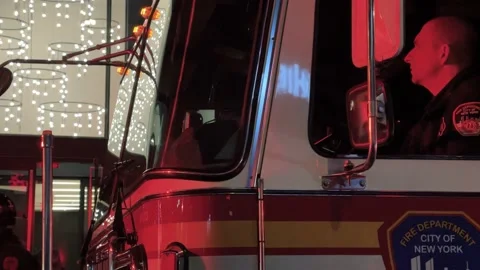 FDNY firefighter driver truck with flashing red lights in New York City NYC Stock Footage