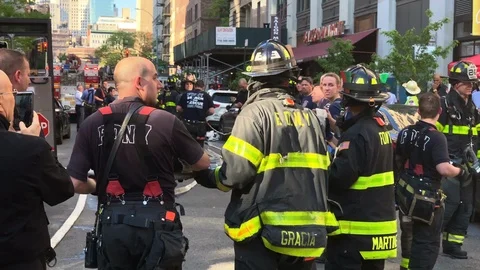 FDNY firefighters threading hose passing working together New York City NYC Stock Footage 107977510
