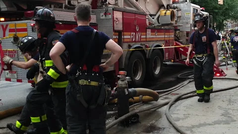 FDNY - NYC Firefighters respond &amp; work at site of building collapse in Brooklyn Stock Footage 134205488