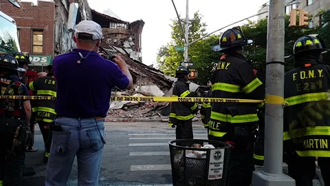 FDNY - NYC Firefighters respond &amp; work at site of building collapse in Brooklyn Stock Footage 134208364