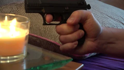 Fear and Weapon in a man's hand Stock Footage 239730027