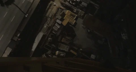 The Fear Of Looking Down From Atop a Crane in the Dark Stock Footage 87722487