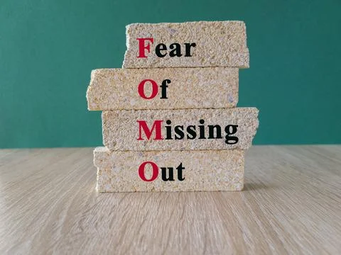 Fear of missing out symbol. Concept words Fear of missing out on brick blocks Stock Photos