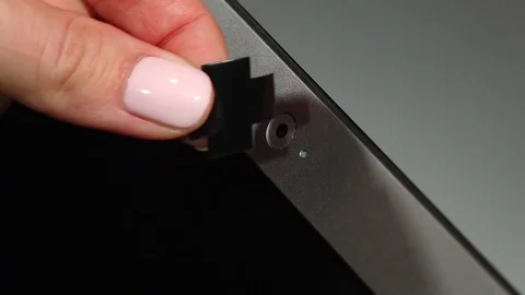 Fear of unauthorized webcam access by malicious software, lens covered by tape Video stock 71619490