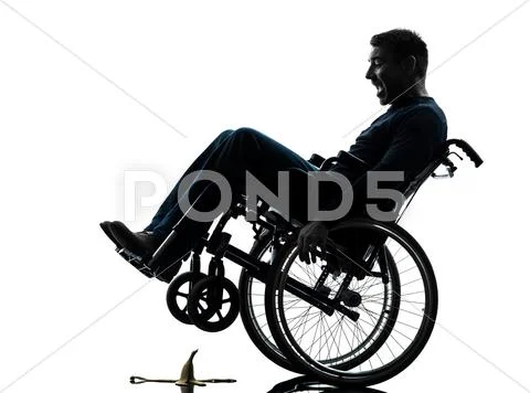 Fearless handicapped man in wheelchair silhouette Stock Photos