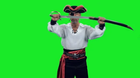 Fearless pirate with an eye patch standing with sword on green background Stock-Footage 304294880