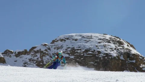 Fearless skier speeding down the snowy mountains during winter Stock Footage 116787735