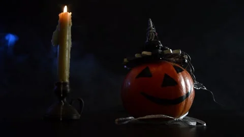Feast of all saints, pumpkin in hat and candle Stock-Footage 85475674