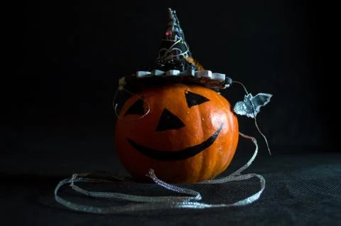 Feast of all saints, pumpkin in hat and candle 2 Fotos de archivo