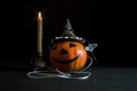Feast of all saints, pumpkin in hat and candle 4 写真素材