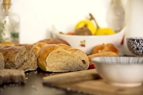 Feast, messy table. Bread in the shape of a braid. Sweet Challah. breakfast Stock Photos
