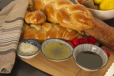 Feast, messy table. Bread in the shape of a braid. Sweet Challah. breakfast Stock Photos
