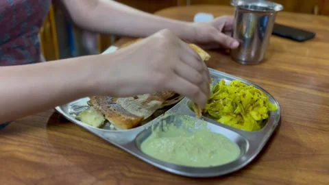 Feasting on Dosa Stock Footage 237499136