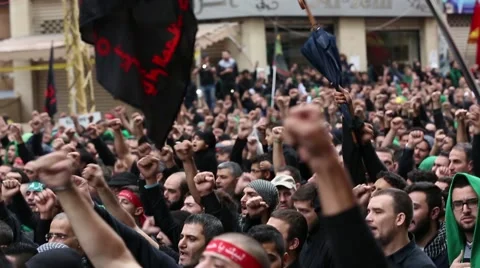 Feasts up during the march of Ashura 2014, southern suburbs of Beirut, Lebanon Video stock 43402253