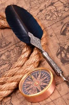 Feather and map Stock Photos
