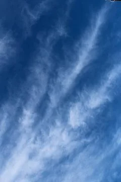 Feather clouds against blue sky Stock Photos